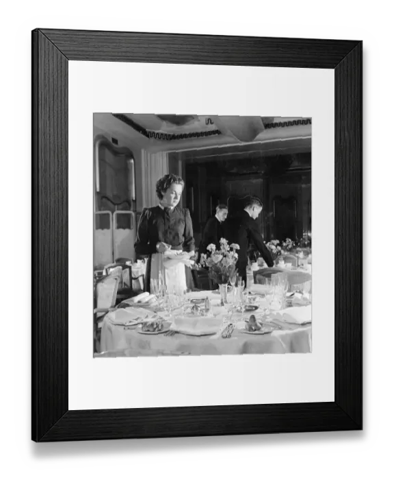Framed Print : Irene Heckman, a waitress at the Lyons Trocadero, lays extra table settings on Framed Print : Irene Heckman, a waitress at the Lyons Trocadero, lays extra table settings on