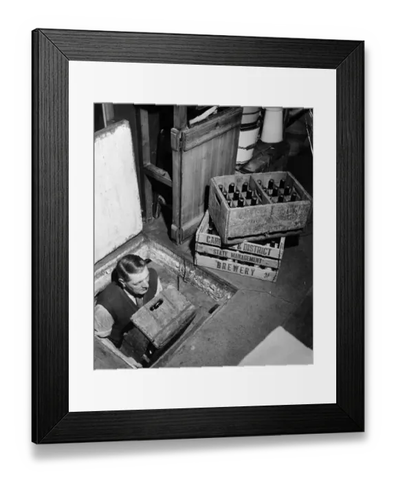 Framed Print : Joe, the landlord, brings up bottles of beer from the cellar to sell at the Globe Tavern Framed Print : Joe, the landlord, brings up bottles of beer from the cellar to sell at the Globe Tavern