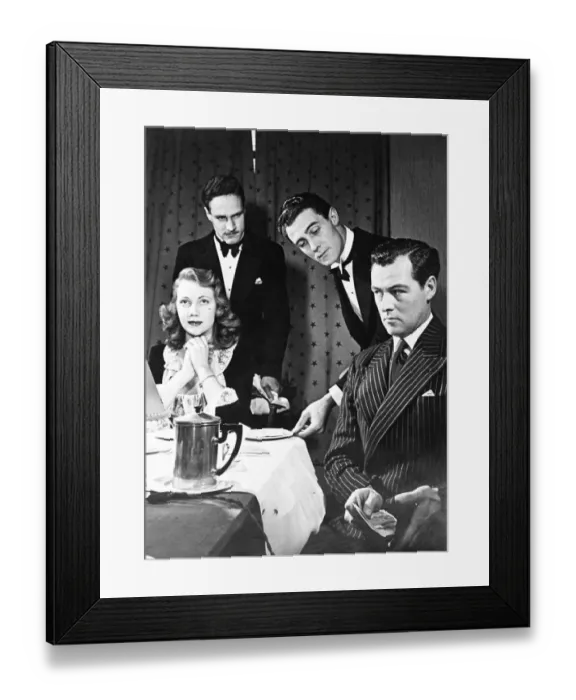 Framed Print : A man wants to impress his lady friend but two waiters produce the bill to the couple after dinner Framed Print : A man wants to impress his lady friend but two waiters produce the bill to the couple after dinner