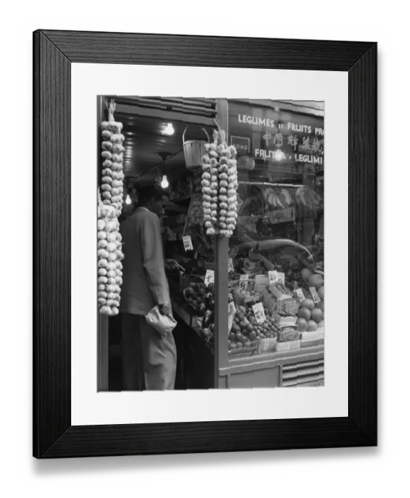Framed Print : A grocer selling a variety of exotic fruit and legumes with a window sign in multiple languages Framed Print : A grocer selling a variety of exotic fruit and legumes with a window sign in multiple languages