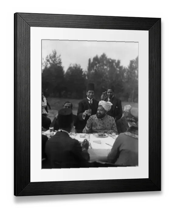 Framed Print : The Imam eating during the Feast of Sacrifice in the gardens of the Mosque in Woking, Surrey Framed Print : The Imam eating during the Feast of Sacrifice in the gardens of the Mosque in Woking, Surrey