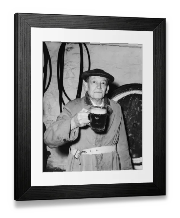 Framed Print : Man with a pint of beer at the Blue Anchor in Helston, Cornwall, England. 11 April 1956 Framed Print : Man with a pint of beer at the Blue Anchor in Helston, Cornwall, England. 11 April 1956