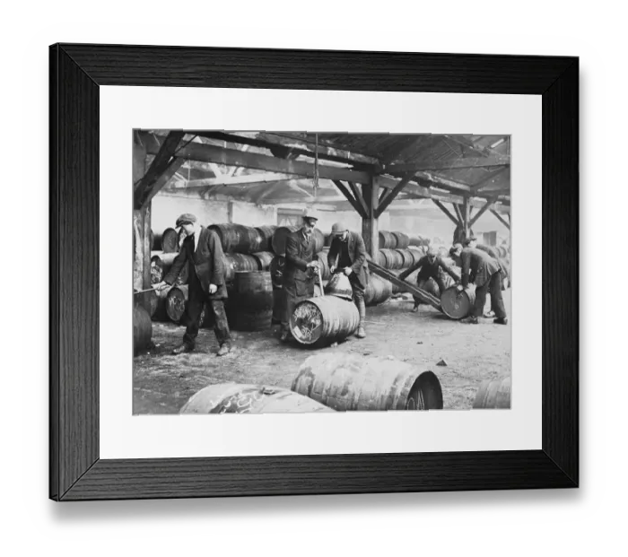 Framed Print : Customs workers at a bonded warehouse in London, England. undated