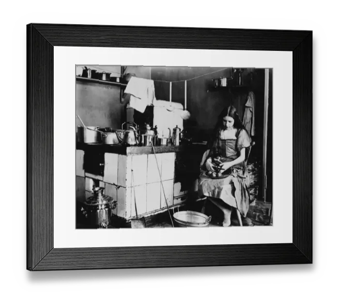Framed Print : A girl peeling apples in a kitchen. c. 1908 Framed Print : A girl peeling apples in a kitchen. c. 1908