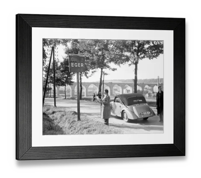 Framed Print : A motorist looking at the sign at the entrance to the town of Eger, the Sudetenland Storm Centre Framed Print : A motorist looking at the sign at the entrance to the town of Eger, the Sudetenland Storm Centre
