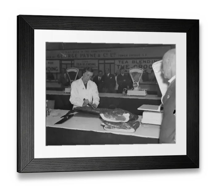 Framed Print : Woman seeks bacon slicer championships at grocers exhibition Framed Print : Woman seeks bacon slicer championships at grocers exhibition