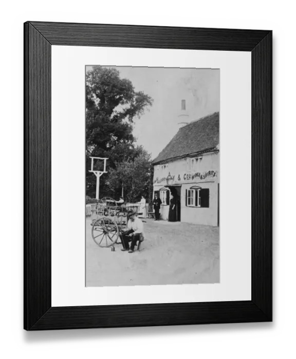 Framed Print : A man with a small cart outside public house at Eversley 1906