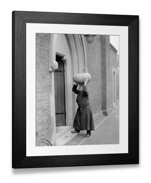 Framed Print : Reverend A. W. Barker prepares to decorate his church for annual harvest festival service