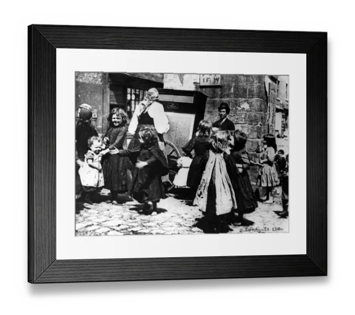 Framed Print : Children dance in the street to an organ grinder