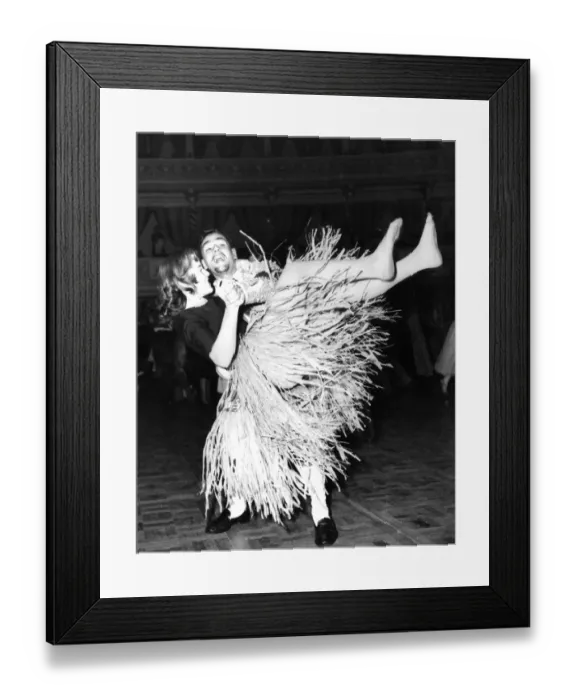 Framed Print : Dancing to rock and roll wearing a grass skirt dance / dancing / party season Framed Print : Dancing to rock and roll wearing a grass skirt dance / dancing / party season