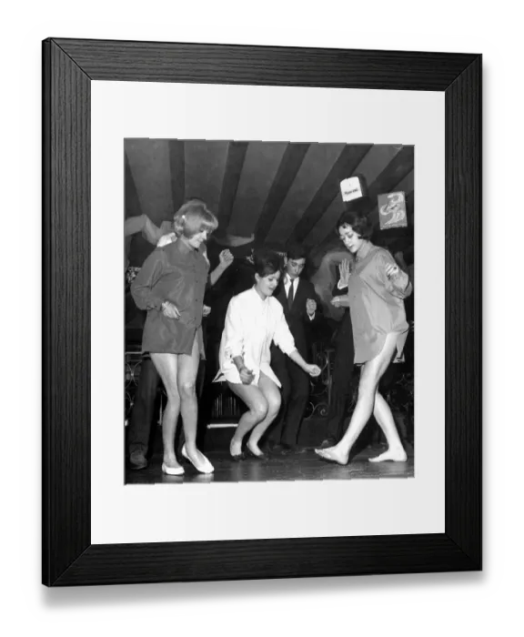 Framed Print : These three young ladies are practicing the newest dance craze, The Twist, while