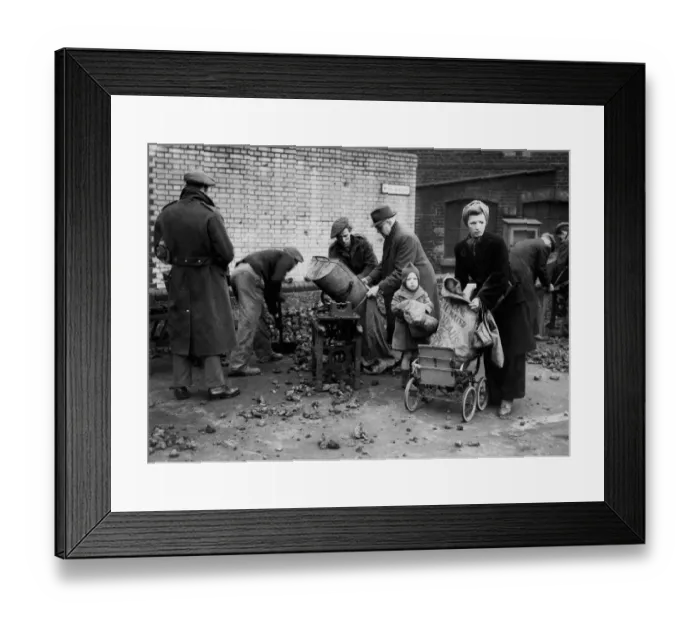 Framed Print : This mother with her baby loads her prams with coke after a long wait in the queue
