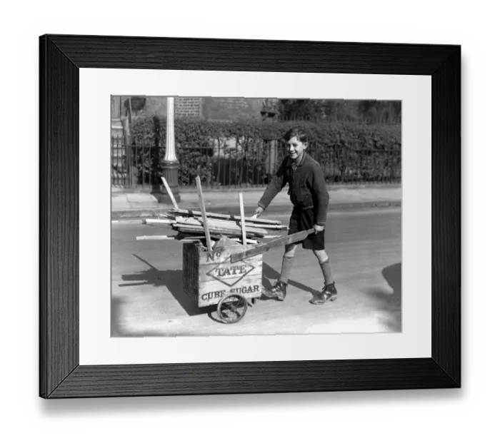 Framed Print : 11 year old Lambeth boy sells firewood from bombed houses for Londons War weapon