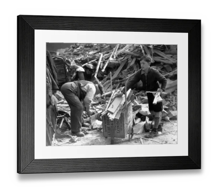 Framed Print : 11 year old Lambeth boy sells firewood from bombed houses for Londons War Weapon Week Framed Print : 11 year old Lambeth boy sells firewood from bombed houses for Londons War Weapon Week