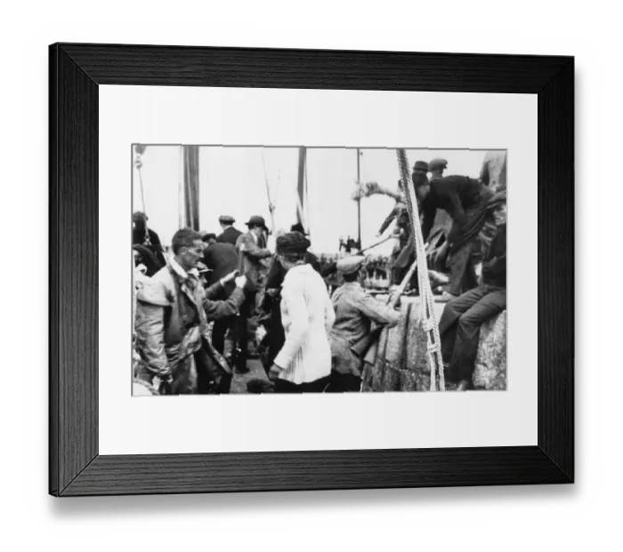 Framed Print : Erskine Childers (in oilskins) as arms landed from the Asgard at Howth in 1914 Aboard Framed Print : Erskine Childers (in oilskins) as arms landed from the Asgard at Howth in 1914 Aboard