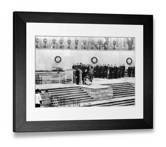 Framed Print : President Eamonn de Valera of Eire ( hatless ) assisted by a uniformed man lays a