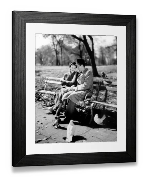 Framed Print : Romantic cliched couple. 1950 s. Couple having a quiet moment in the park