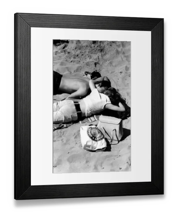 Framed Print : Young couple on the beach 1960s love couple romance romantic for valentines Framed Print : Young couple on the beach 1960s love couple romance romantic for valentines