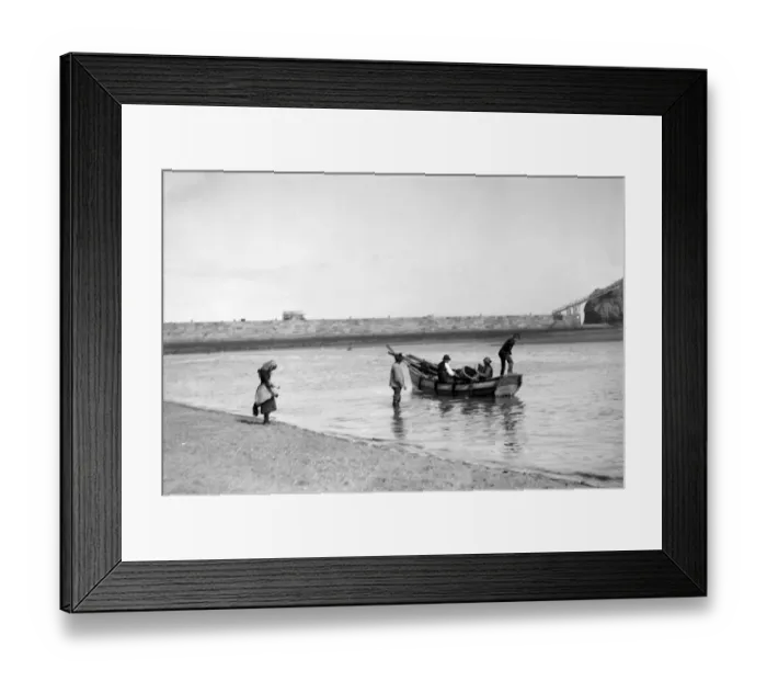 Framed Print : People out fishing from a Coble ( a locally made fishing boat ) at low tide, near Framed Print : People out fishing from a Coble ( a locally made fishing boat ) at low tide, near