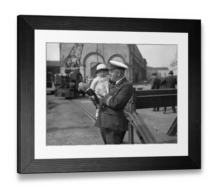 Framed Print : 22 month baby Louise Passmore in the arms of Captain Lock on arrival at Southampton Framed Print : 22 month baby Louise Passmore in the arms of Captain Lock on arrival at Southampton