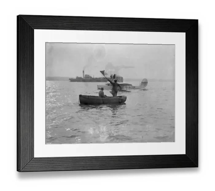 Framed Print : Pilot prepares for trans Atlantic air service, signalling with an emergency semaphore
