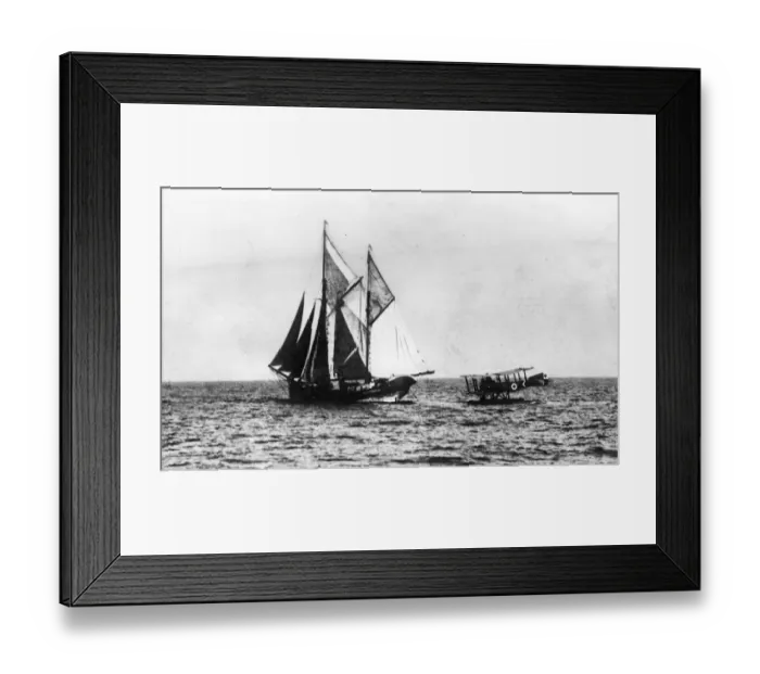 Framed Print : A German seaplane comes down on the water to stop a British sailing ship. 1914 - 1918