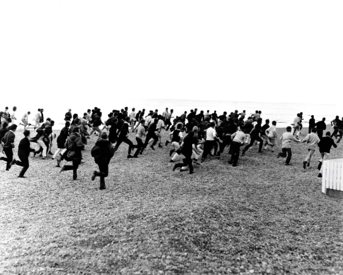 Framed Print : 1964. Hastings. Mods and Rockers clash. 3rd August. Racing along the beach