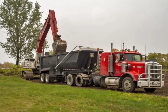 Framed Print : A 6x4 red Kenworth atic unit with a twin axle tipping trailer being loaded at Sudbury Framed Print : A 6x4 red Kenworth atic unit with a twin axle tipping trailer being loaded at Sudbury