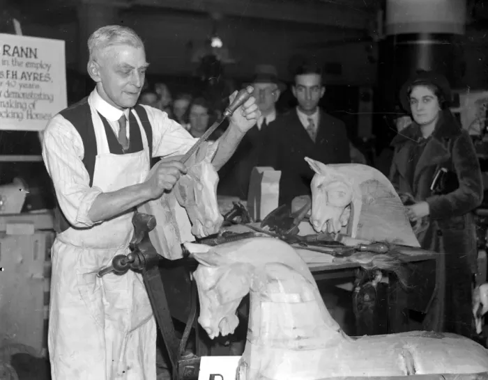 Framed Print : (74 Hillfield Avenue, N. 8) Mr Rann, for 50 years a maker of wooden horses, demonstrates Framed Print : (74 Hillfield Avenue, N. 8) Mr Rann, for 50 years a maker of wooden horses, demonstrates