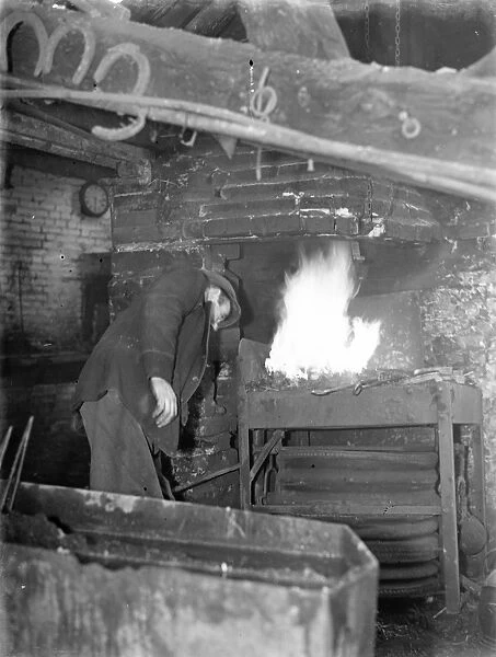 9 November 1940 Doug Hollands blacksmith forge, over 100 years old. Despite being