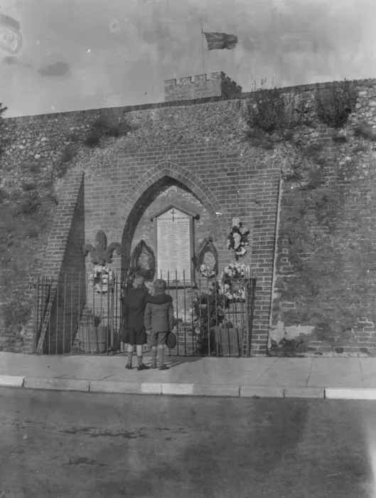 Framed Print : Armistice memorial service in Crayford, Kent. Two boys pay their respect