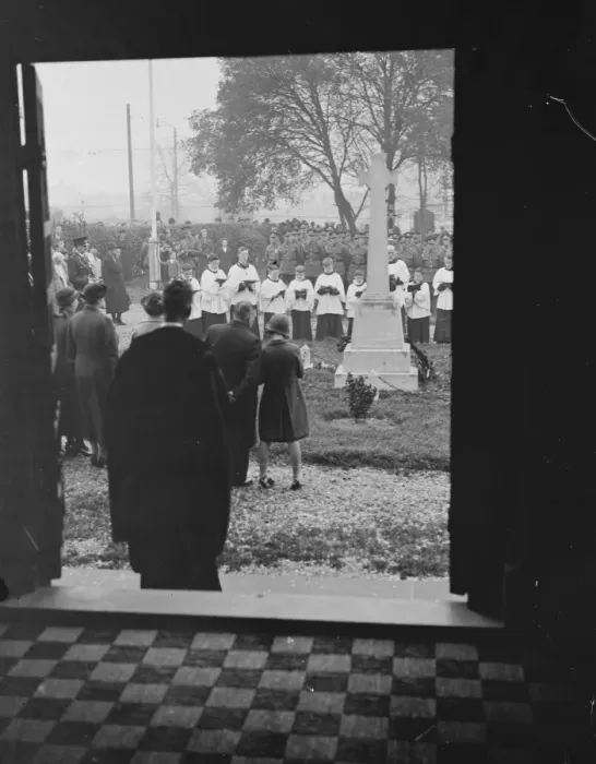 Framed Print : Armistice memorial service in Erith, London, observed through a doorway