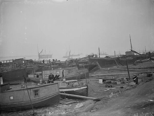 Barges on the shoreline at Gravesend Reach. 1938