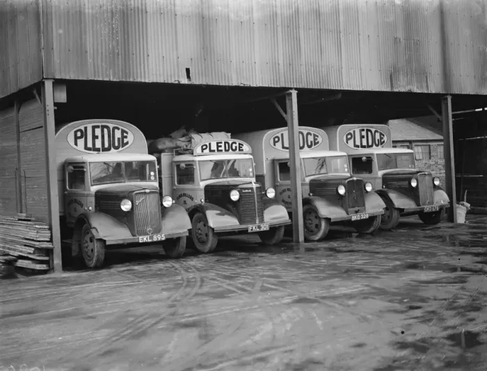 Framed Print : Bedford trucks belonging to Pledge & Son Ltd, the milling company, in a garage