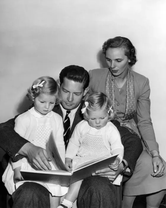 Framed Print : A bedtime story for Princess Margaret (3 1 / 2) and Princess Helen (2) is read by father Framed Print : A bedtime story for Princess Margaret (3 1 / 2) and Princess Helen (2) is read by father