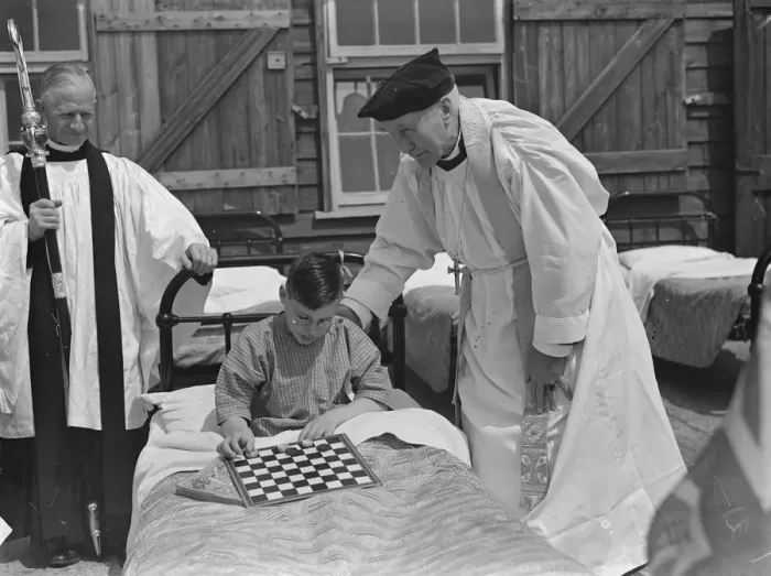 Framed Print : Bishop of London ( Arthur Winnington-Ingram ) with one of the little patients during