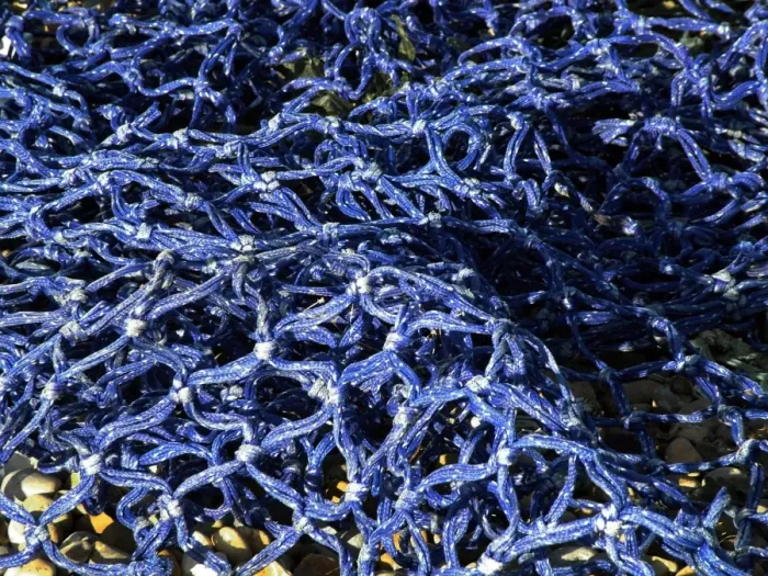 Framed Print : Detail of blue fishing net in the sunshine credit: Marie-Louise Avery  /  thePictureKitchen