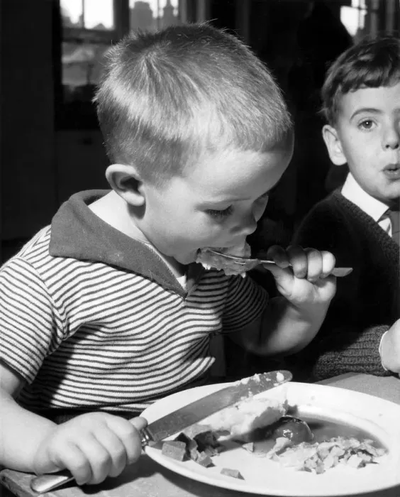 Framed Print : Bobby Mitchell, age 5 during lunch at Melcombe Infants School, Fulham Palace Road, London