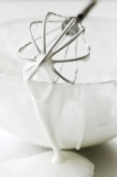 Framed Print : Bowl of white icing with dripping balloon whisk credit: Marie-Louise Avery  /  thePictureKitchen