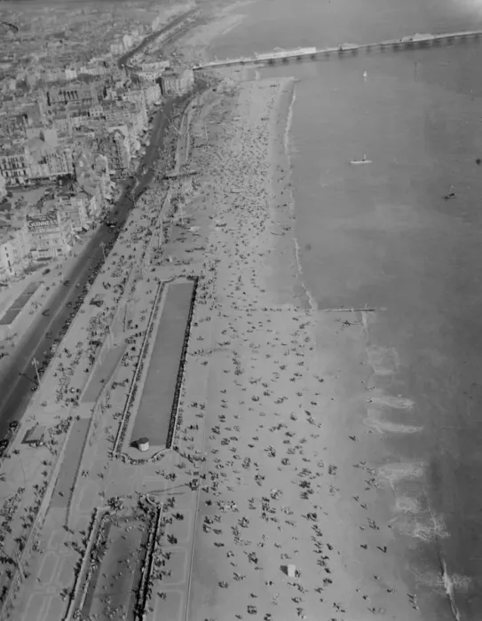 Framed Print : Brighton Beach photographed from the air today, Easter Sunday, as thousands of holidaymakers Framed Print : Brighton Beach photographed from the air today, Easter Sunday, as thousands of holidaymakers
