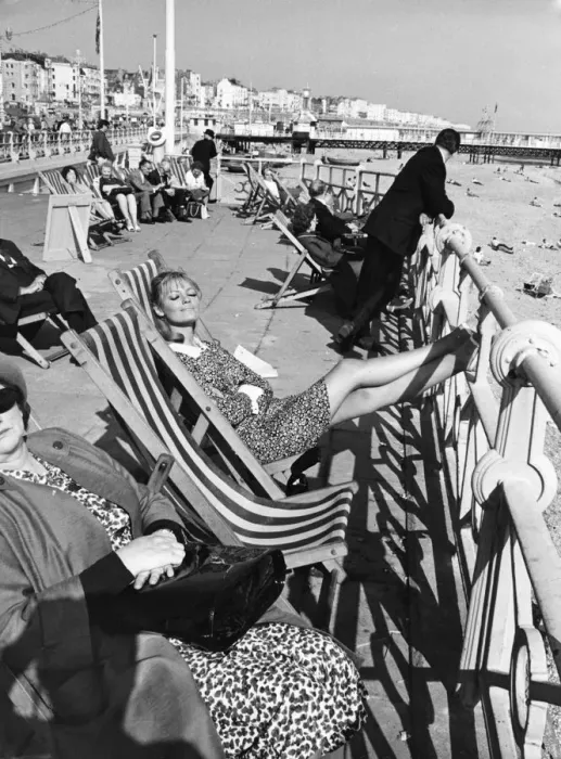 Framed Print : Brighton - enjoying the sunshine sitting in deckchairs on the Promenade at Brighton 28th