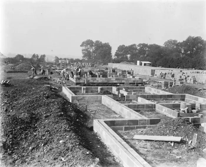 Framed Print : Building a concrete village at Braintree, Essex In the foreground a new foundation setting