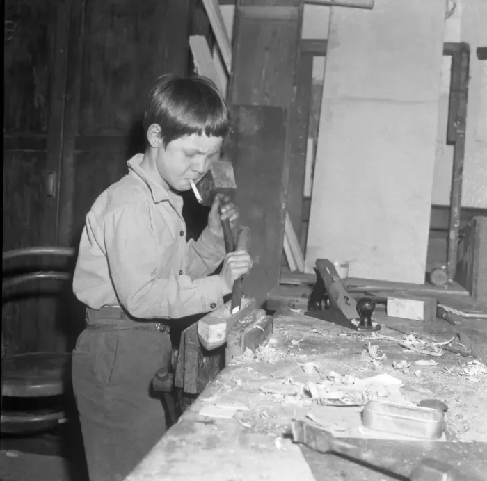 Framed Print : Burgess Hill, Sussex, England : Concentration on carpentry calls for a cigarette