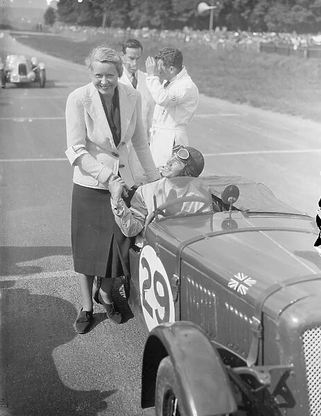 C. J Dodson, who has won the race twice before, receiving the good wishes of his wife