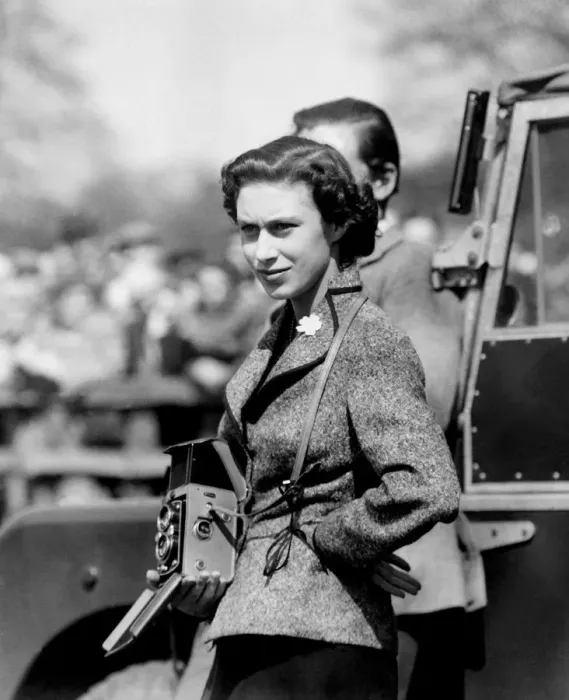 Framed Print : With Camera Ready, the Princess Watched Badminton, Gloucester : Wearing a flower Framed Print : With Camera Ready, the Princess Watched Badminton, Gloucester : Wearing a flower