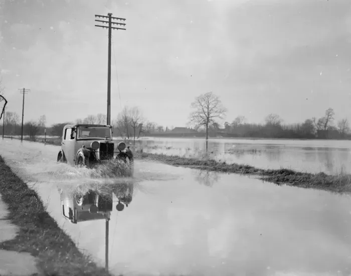 Framed Print : A car risks the floods in Yalding, Kent. 1936