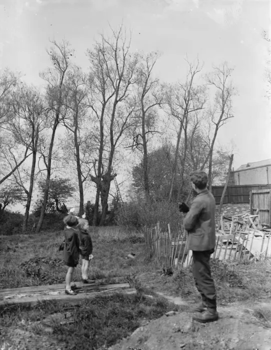 Framed Print : Charles points to the tree from where he rescued the black cat that he is holding Framed Print : Charles points to the tree from where he rescued the black cat that he is holding