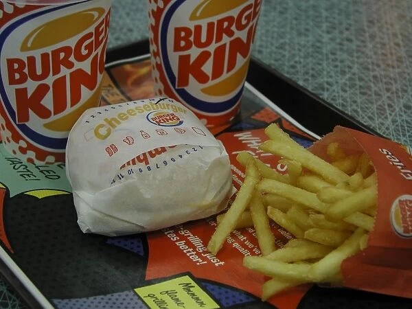 Cheeseburger, chips and soft drinks on a tray at a Burger King restaurant, Canterbury