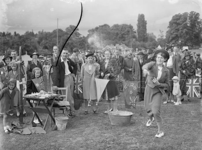 Framed Print : The Chelsfield fete in Kent. A women takes part in one of the side shows