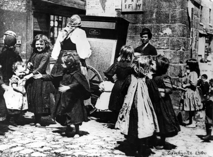 Framed Print : Children dance in the street to an organ grinder